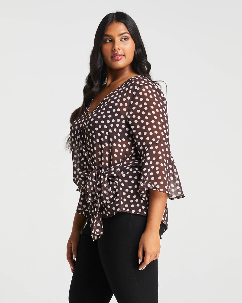 Side of a model wearing a size 1X Fuzzy Spot Top in Choc/Milk by Estelle. | dia_product_style_image_id:264226